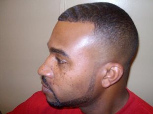 a black colored male with a brand new fade haircut