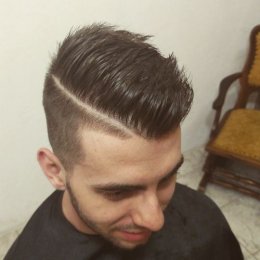Mens undercut hairstyle with a side part
